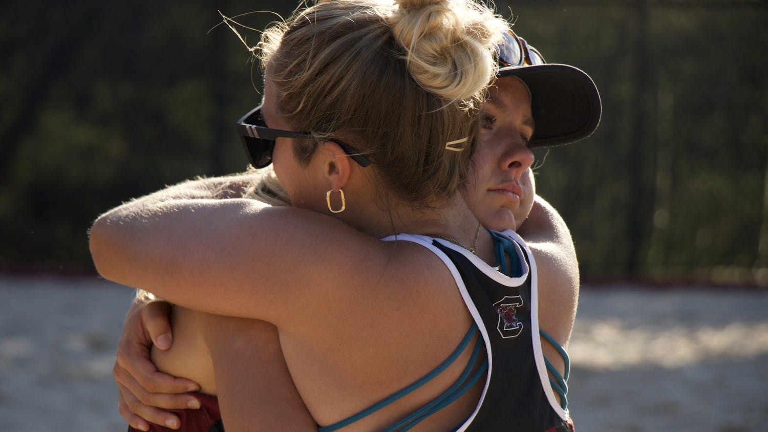 Senior Peyton Gray and junior Lizzie Thompson share an emotional hug on April 15, 2023, at Wheeler Beach. The match was both Thompson's and Gray's last with the Gamecocks. &nbsp;