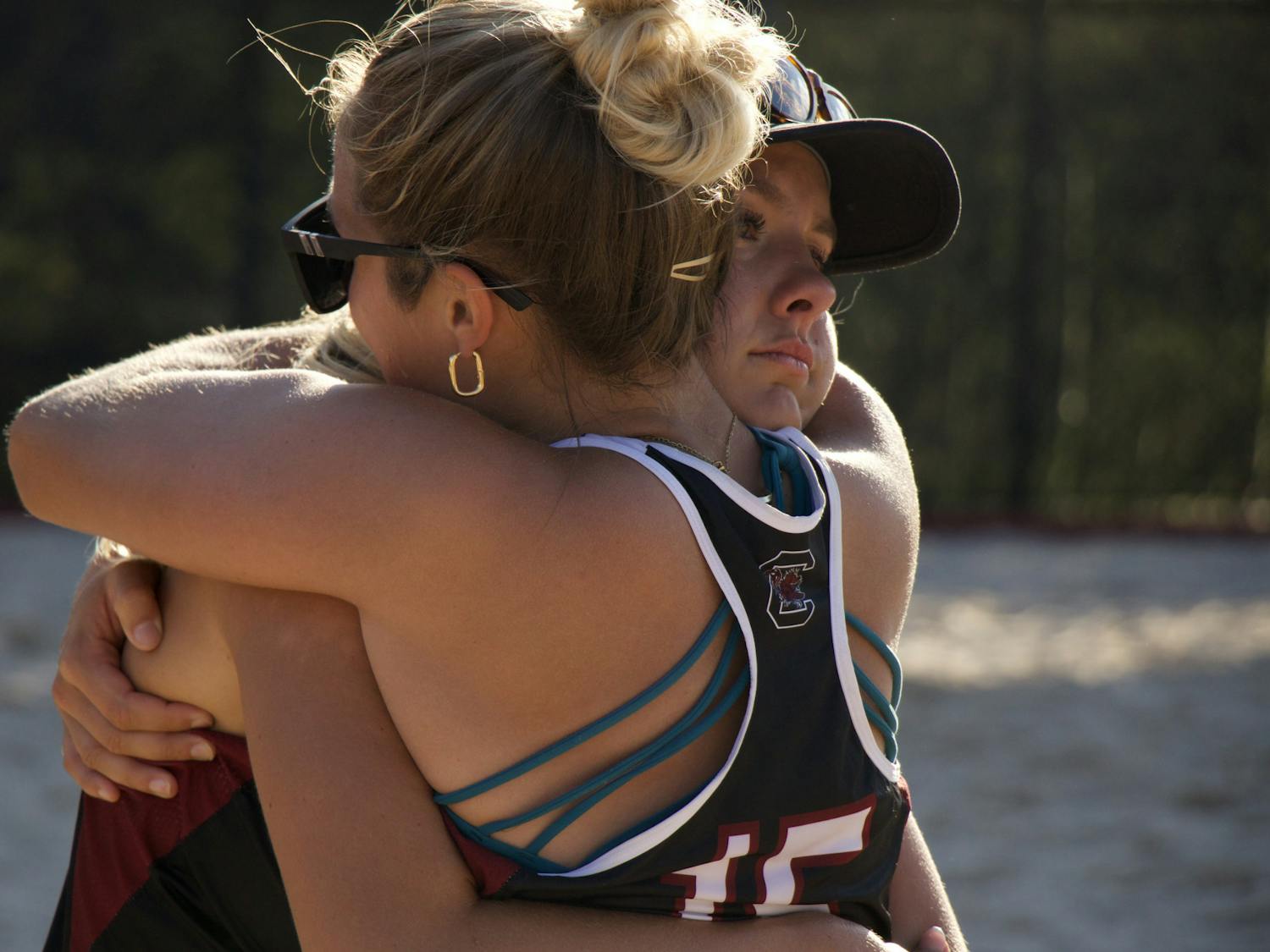 Senior Peyton Gray and junior Lizzie Thompson share an emotional hug on April 15, 2023, at Wheeler Beach. The match was both Thompson's and Gray's last with the Gamecocks. &nbsp;