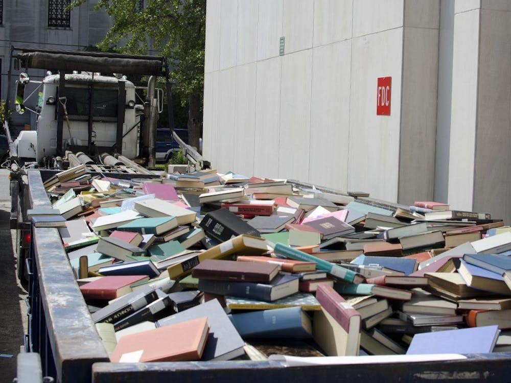 The S.C. State Library sends a dumpster full of books to be recycled Thursday afternoon.