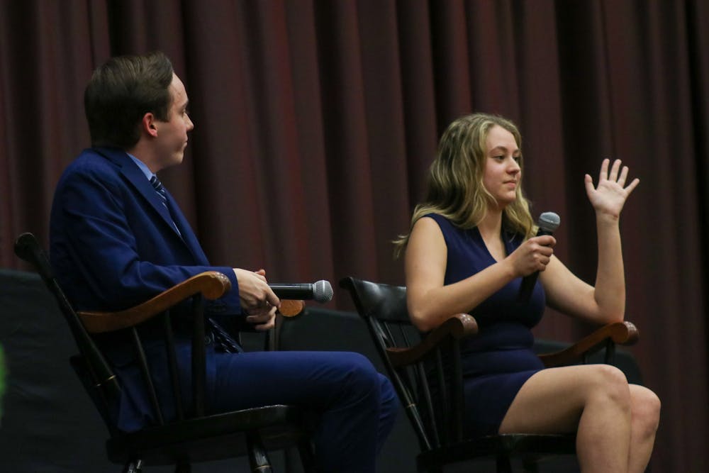<p>Second-year political science student Jordyn Vélez raises her hand to interject third-year international studies and criminal justice student Cameron Eubanks during the Student Government debate on Feb. 15, 2023. Both Vélez and Eubanks are vying for the position of speaker of the student senate.</p>