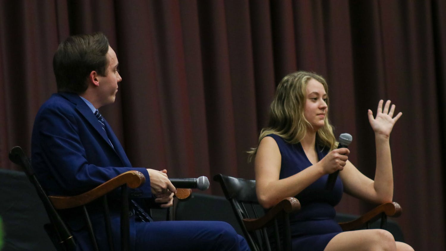 Second-year political science student Jordyn Vélez raises her hand to interject third-year international studies and criminal justice student Cameron Eubanks during the Student Government debate on Feb. 15, 2023. Both Vélez and Eubanks are vying for the position of speaker of the student senate.