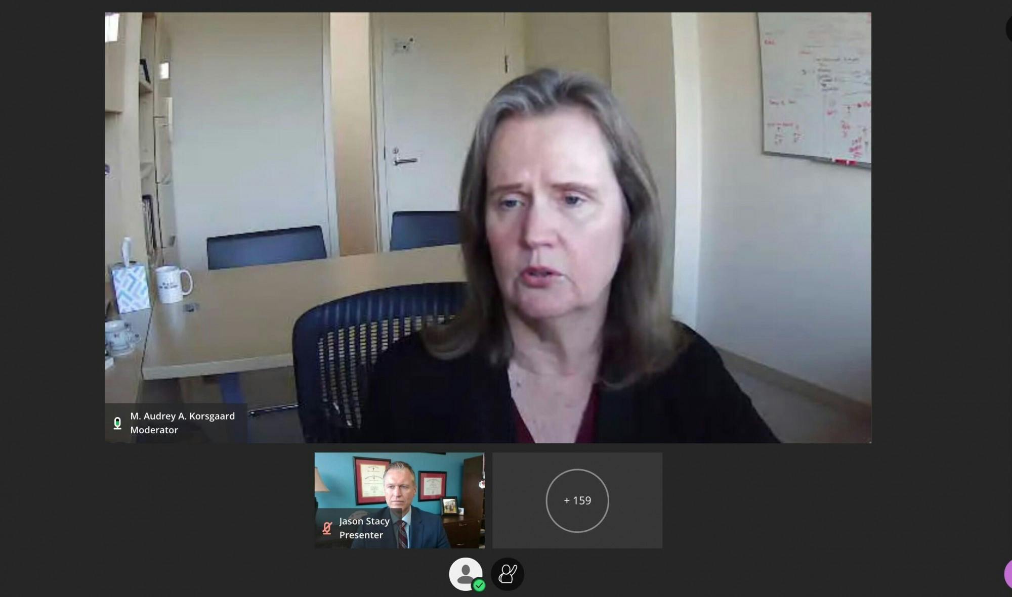 Moderator Audrey Korksgaard speaks to guest speaker Dr. Jason Stacey on Feb. 2, 2022. Dr. Jason Stacey, the interim vice president of health and well-being and Chief Health Officer.