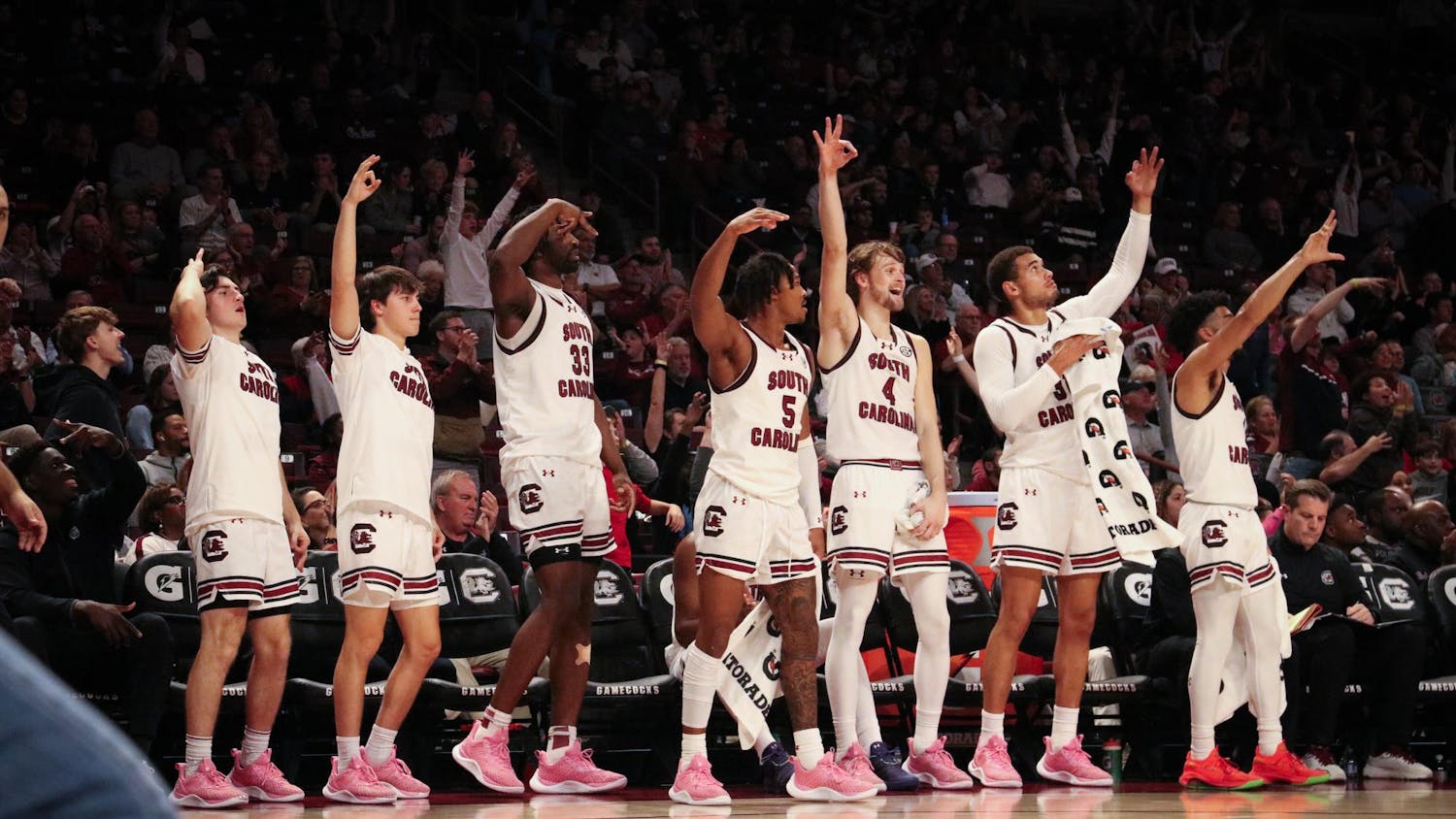 FILE — The South Carolina men's basketball team celebrates as the team scores late in the game against George Washington on Dec. 1, 2023. The Gamecocks made 51% of 3-pointers against the Revolutionaries/