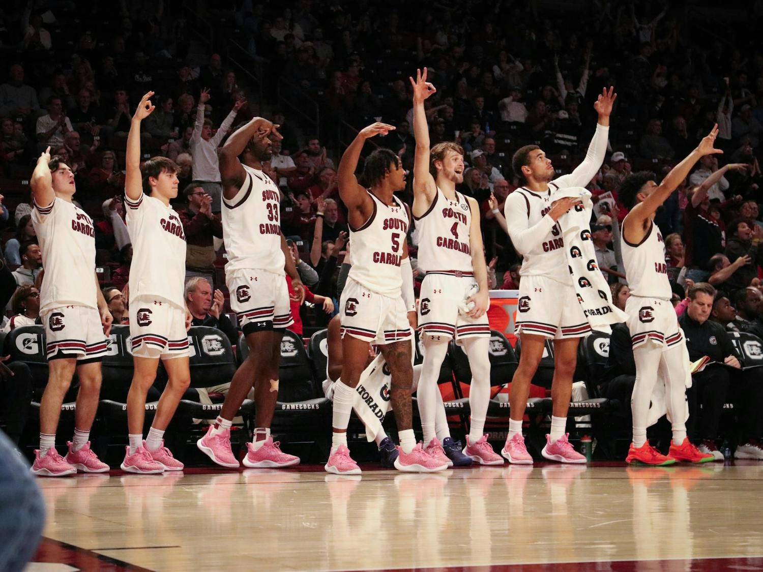 FILE — The South Carolina men's basketball team celebrates as the team scores late in the game against George Washington on Dec. 1, 2023. The Gamecocks made 51% of 3-pointers against the Revolutionaries/