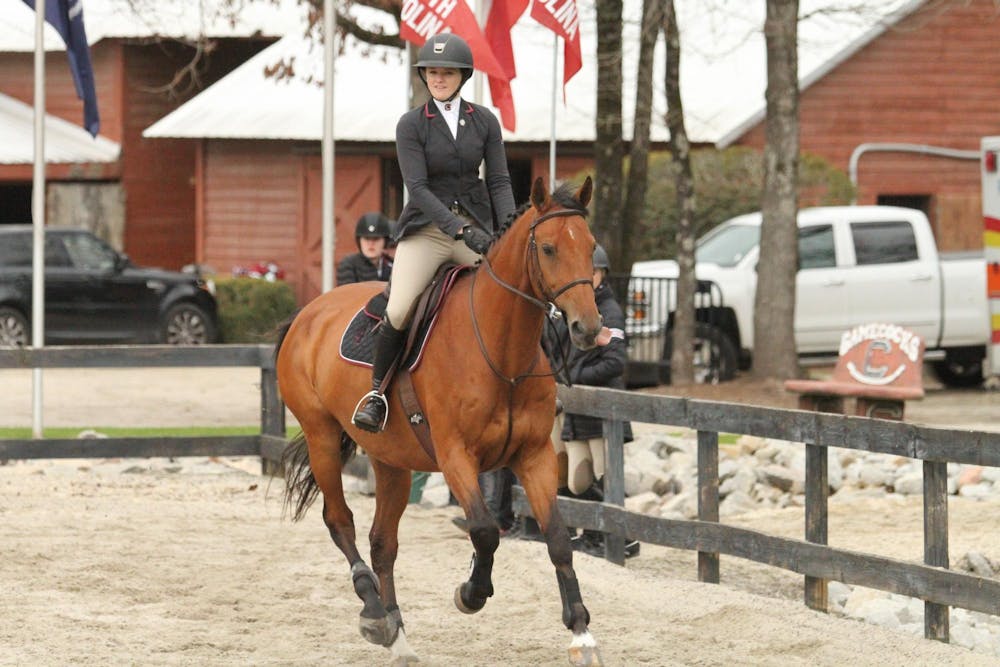 <p>FILE — Senior Madeline Schaefer mounted on Tanner competes in the fences category during the meet against Texas A&amp;M at One Wood Farm on Feb. 11, 2023. Of the horses that she competed on during her time at Carolina, two are in the top Schaefer’s list of favorites.</p>