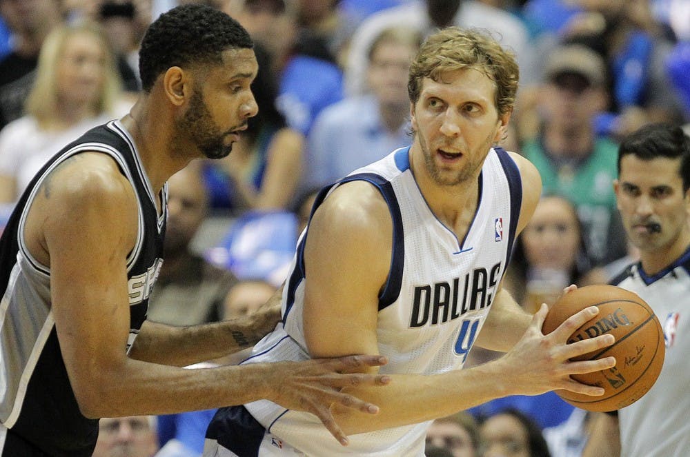 San Antonio Spurs forward Tim Duncan, left, guards Dallas Mavericks forward Dirk Nowitzki (41) in the first half of Game 6 of an NBA Western Conference quarterfinal at the American Airlines in Dallas, Friday, May 2, 2014. (Ron Jenkins/Fort Worth Star-Telegram/MCT)