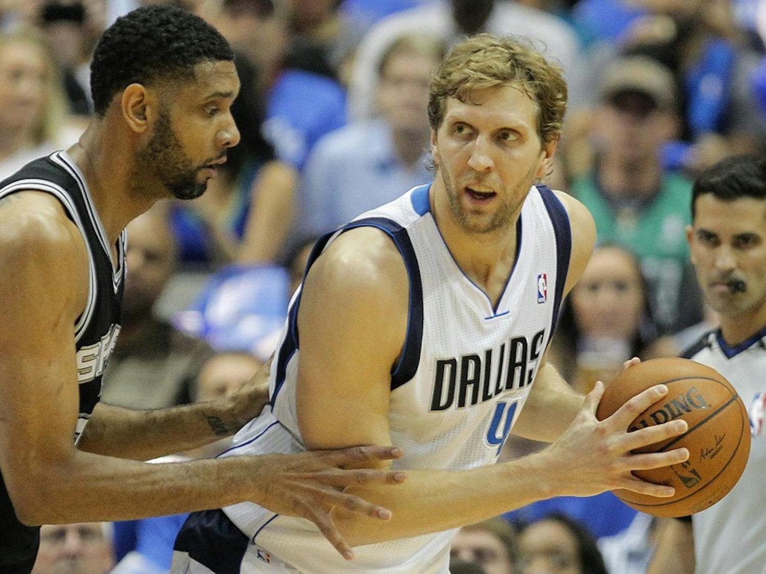 San Antonio Spurs forward Tim Duncan, left, guards Dallas Mavericks forward Dirk Nowitzki (41) in the first half of Game 6 of an NBA Western Conference quarterfinal at the American Airlines in Dallas, Friday, May 2, 2014. (Ron Jenkins/Fort Worth Star-Telegram/MCT)