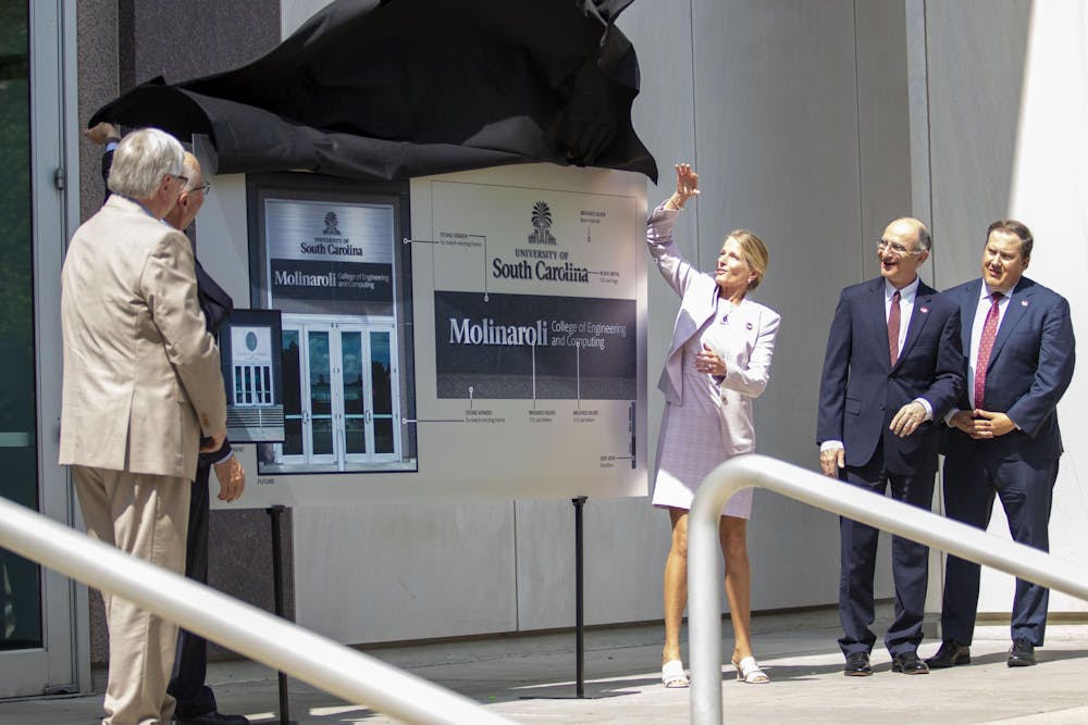 <p>Alex Molinaroli, Kristin Ihle Molinaroli, Michael Amiridis and others unveiled the new name and banner for the 鶹С򽴫ý Molinaroli College of Engineering and Computing on June 6, 2024. The 鶹С򽴫ý Board of Trustees approved a $30 million donation from Alex Molinaroli, a 鶹С򽴫ý alumnus.</p>