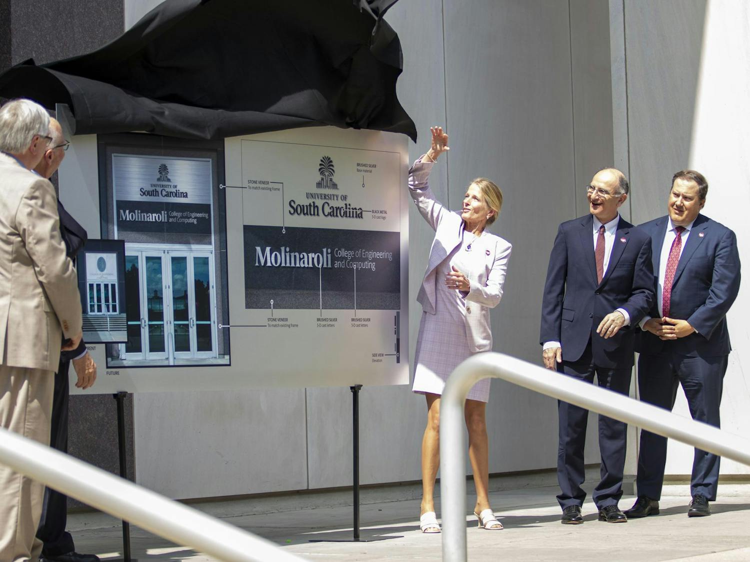 Alex Molinaroli, Kristin Ihle Molinaroli, Michael Amiridis and others unveiled the new name and banner for the USC Molinaroli College of Engineering and Computing on June 6, 2024. The USC Board of Trustees approved a $30 million donation from Alex Molinaroli, a USC alumnus.