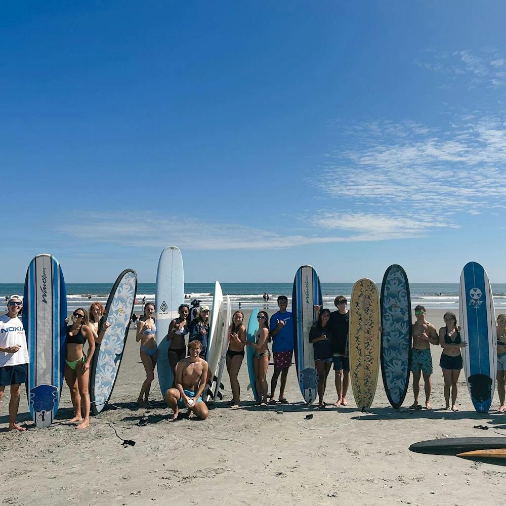 <p>The Gamecock Surf Club poses for a group photo at Folly Beach during the fall 2023 semester. The group also has ventured to Carolina Beach and Ocean Fest, a charity music festival in North Carolina.</p>