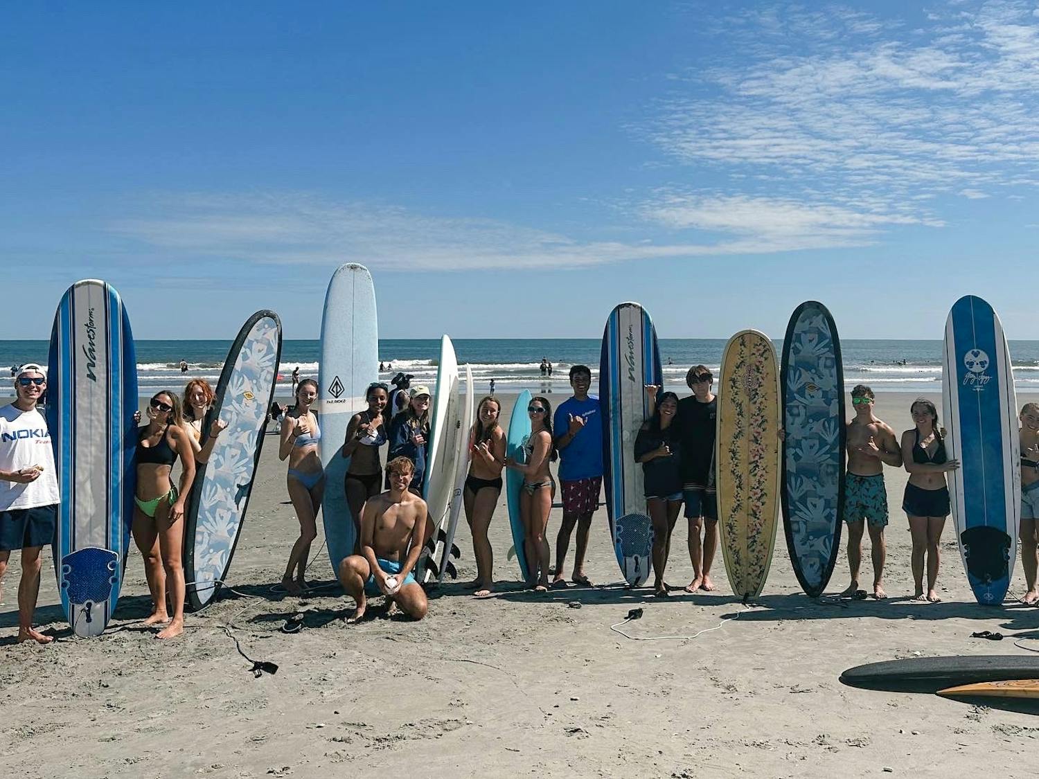 The Gamecock Surf Club poses for a group photo at Folly Beach during the fall 2023 semester. The group also has ventured to Carolina Beach and Ocean Fest, a charity music festival in North Carolina.