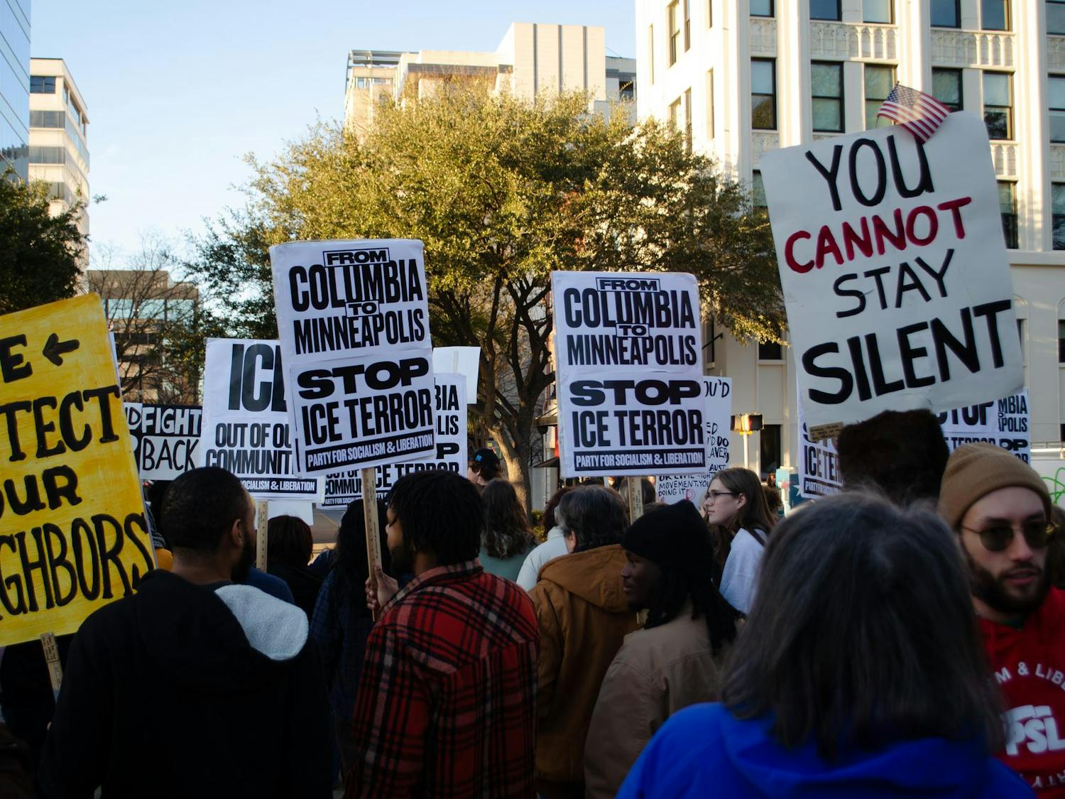 Protesters carry signs from the Party for Socialism and Liberation opposing U.S. Immigration and Customs Enforcement at a protest at the statehouse in Columbia, South Carolina, on Jan. 20, 2026. Minneapolis, Minnesota, is the most recent target of the Trump administration’s mass deportation efforts.