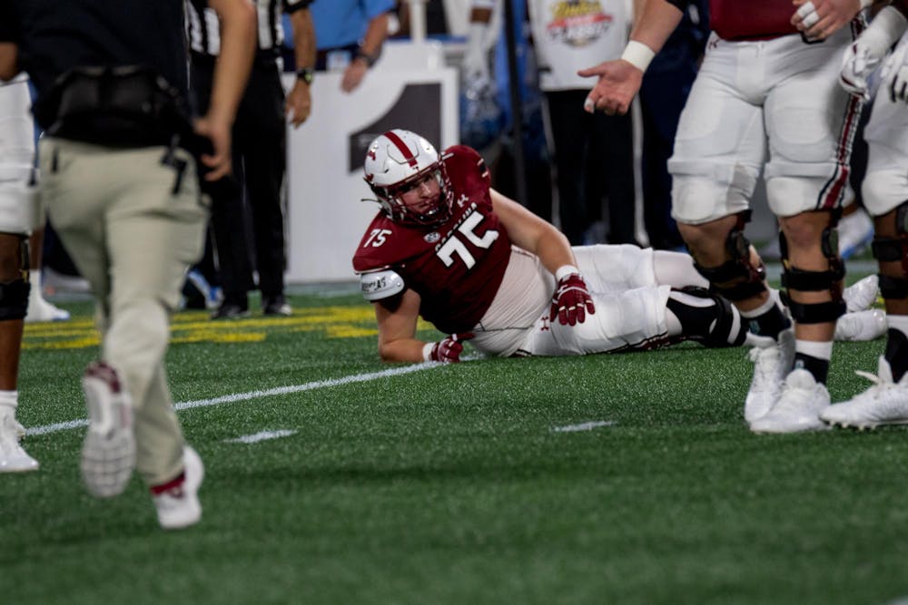 <p>Redshirt freshman offensive lineman Cason Henry gets medical attention during the Gamecocks football game on Saturday, Sept. 2, 2023. The Gamecocks lost to the UNC Tar Heels 31-17.</p>