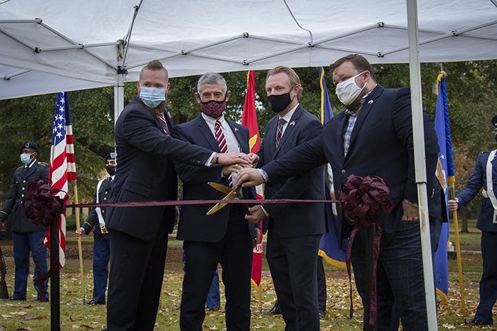 From left to right: Brooks Herring, President Bob Caslen, Jared Evans and Scott Craig cut the ribbon to the new Veteran and Military Center of Excellence at the Horseshoe on Nov. 11, 2020.