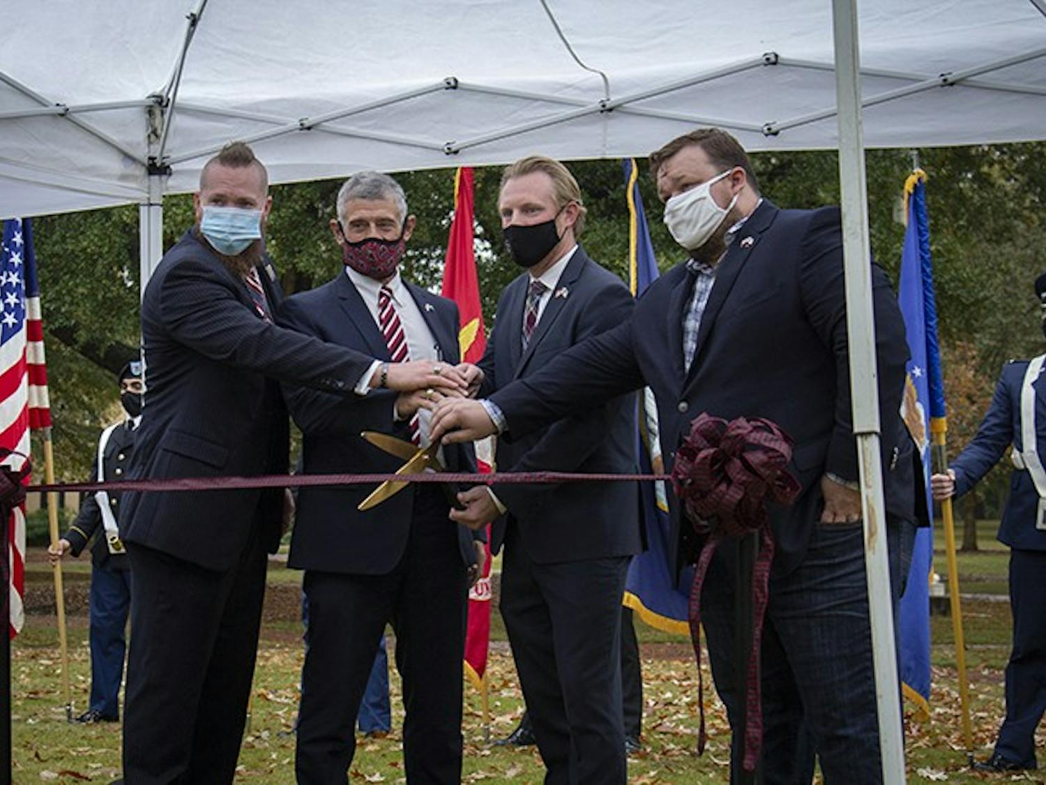 From left to right: Brooks Herring, President Bob Caslen, Jared Evans and Scott Craig cut the ribbon to the new Veteran and Military Center of Excellence at the Horseshoe on Nov. 11, 2020.