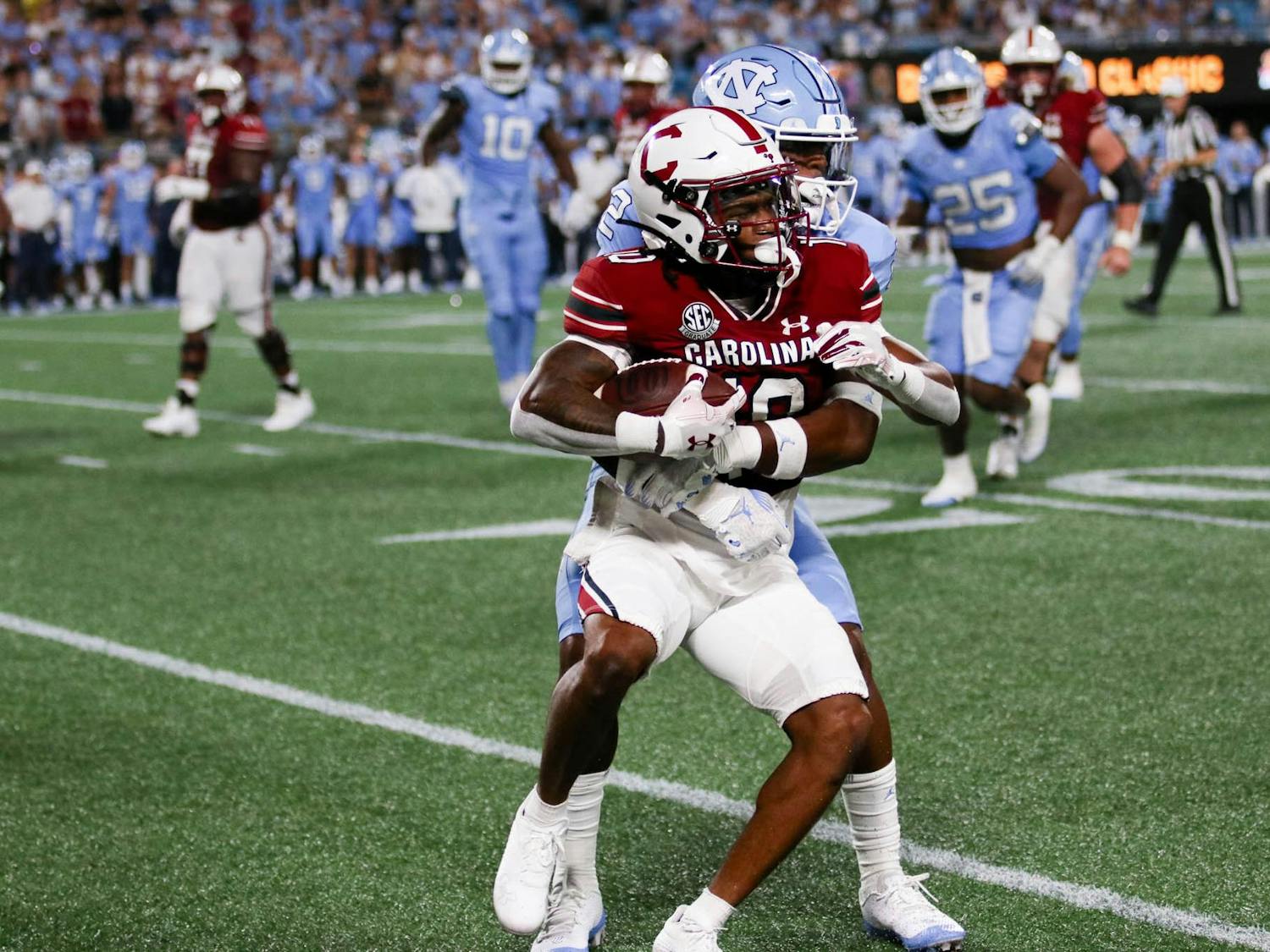 Fifth-year wide receiver Ahmarean Brown is tackled after gaining yards for South Carolina. The Gamecocks lost to the Tar Heels 31-17 on Sept. 2, 2023.