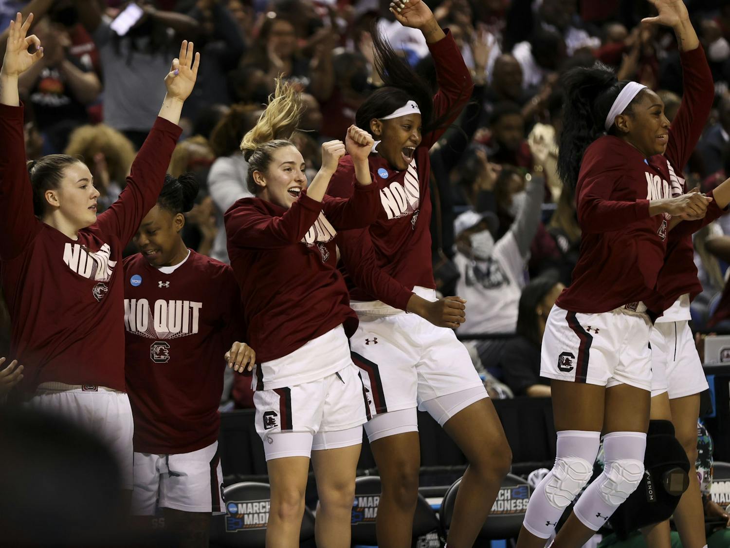 South Carolina's bench celebrates three-pointer in the second quarter of South Carolina's 69-61 victory over North Carolina in the Sweet Sixteen on March 25, 2022.