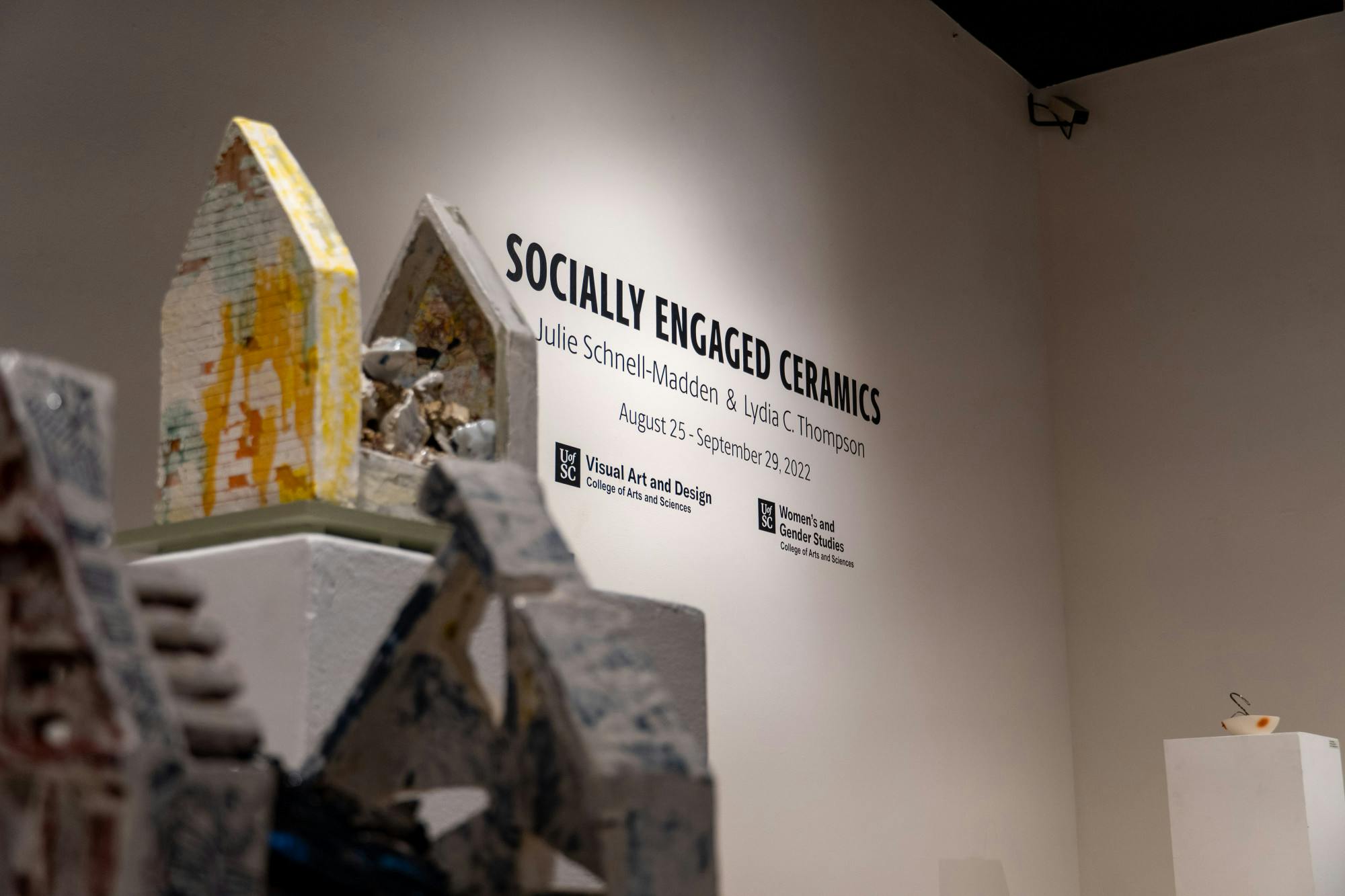 Ceramic sculptures and roses sit on podiums in the McMaster Gallery in USC's McMaster College, home to the School of Visual Art and Design on Sept. 27, 2022. This gallery, titled "Socially Engaged Ceramics" features artwork from Julie Schnell-Madden and Lydia C. Thompson and is co-sponsored by the Women’s and Gender Studies Program. Photos captured by Jalen Miller | The Daily Gamecock