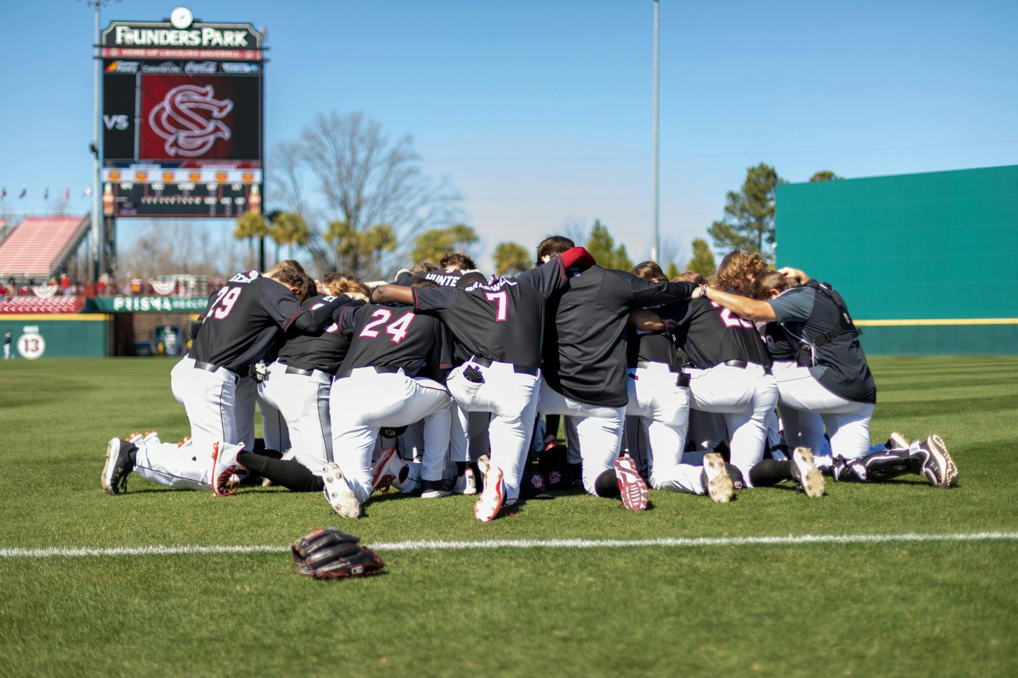 South Carolina's baseball team prays before a game against UNCG on Feb. 20, 2022.
