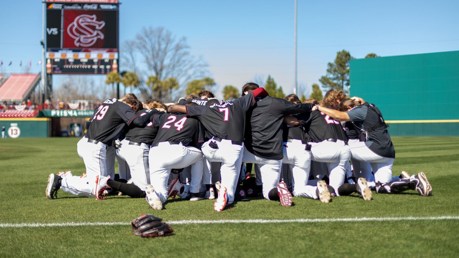 South Carolina's baseball team prays before a game against UNCG on Feb. 20, 2022.