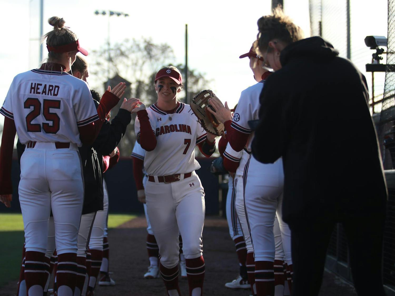 Sixth-year outfielder Abigail Knight is welcomed onto the field by her teammates on Feb. 21,2025 at Beckham field for their game against Boston University. Knight finished the day with two hits and two runs.