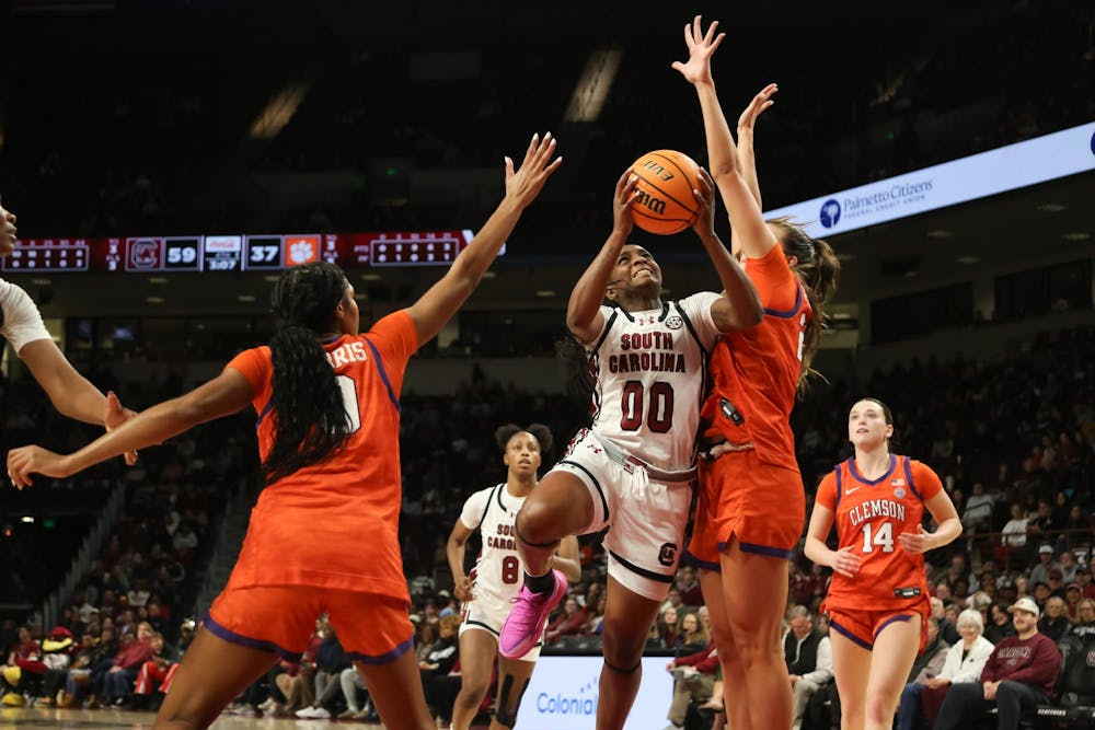 <p>Senior guard Ta’Niya Latson goes for a layup over a defender from Clemson on Nov. 11, 2025, at Colonial Life Arena. Latson has scored 49 points on the season after the Gamecocks' 65-37 win over the Tigers.</p>