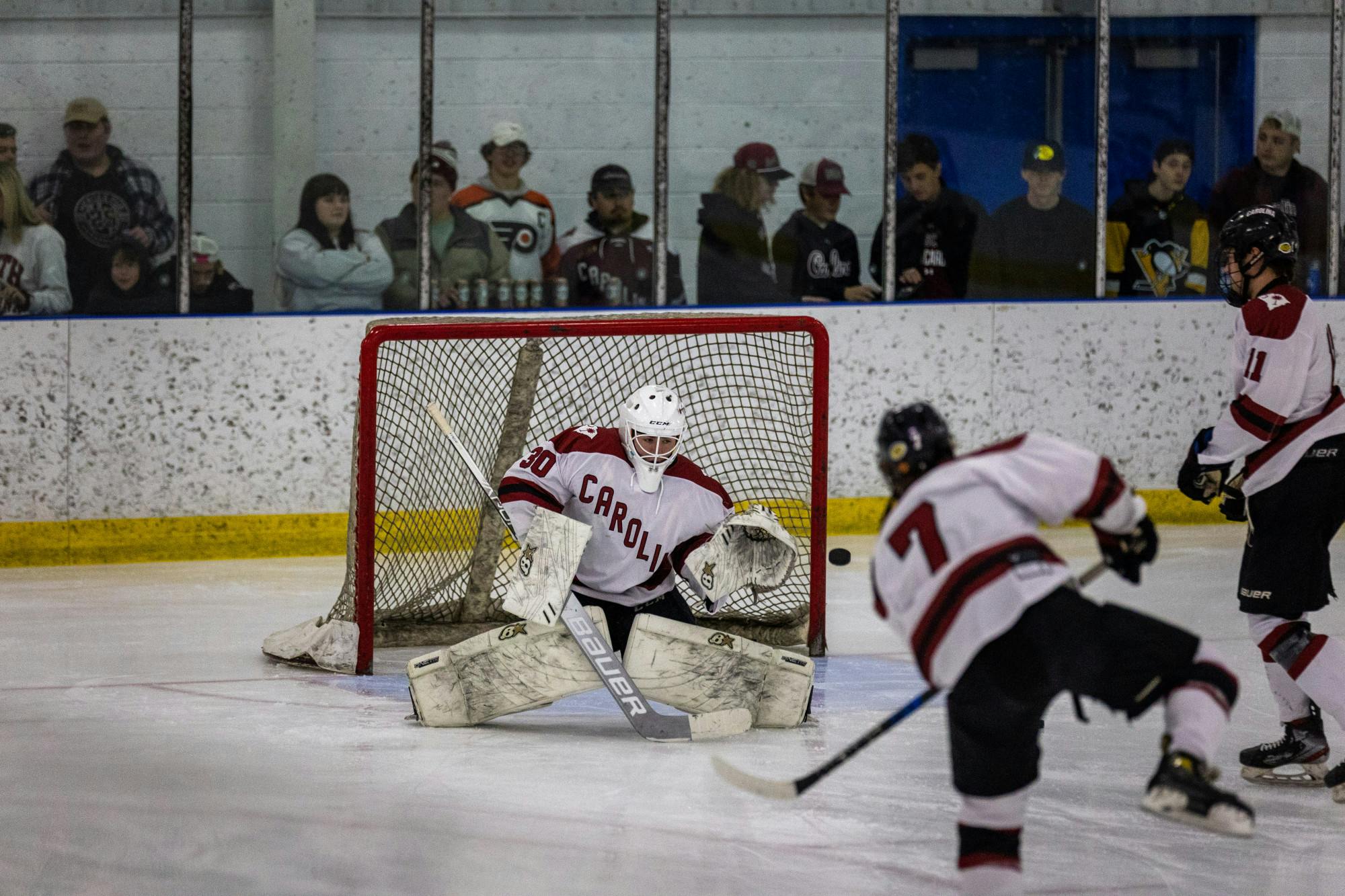 In a highly anticipated matchup between rivals, the South Carolina club hockey team powered past a tough Clemson defense to pull out a nail-biting 5-4 victory.
The game featured a number of stops from senior goalie Liam Gormley that played a crucial role keeping the Tigers at bay. Cock Hockey, a competitive club sport, has seen a growing popularity with students and hockey fans as its attendance continues to rise.&nbsp;
Photos captured by Rachael Barkoff | The Daily Gamecock