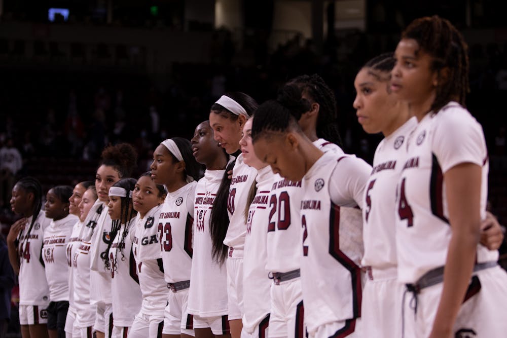 <p>FILE—The South Carolina women's basketball team lines up on the court at Colonial Life Area in Columbia, SC on Feb. 13, 2022.&nbsp;</p>