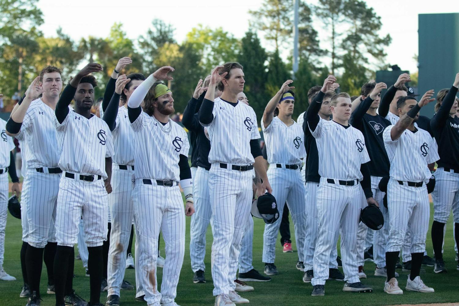 University of South Carolina baseball players make a toast while the alma mater plays after a loss to Texas A&amp;M on April 6, 2024. The Gamecocks are 21-10 overall on the season.