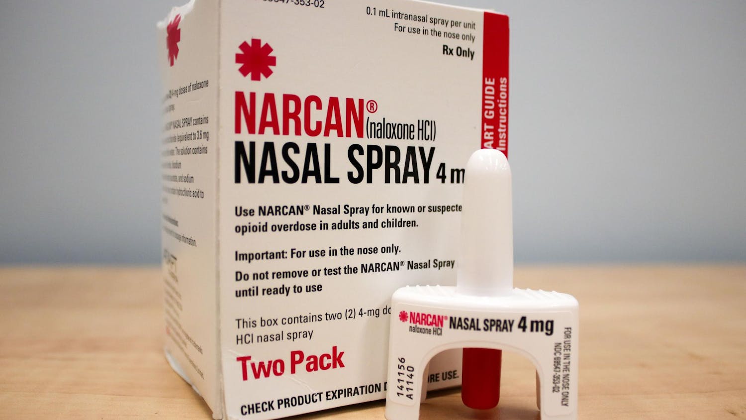 A photo illustration of a box of Narcan and a nasal spray container. Narcan is a brand name for the medication Naloxone, which is used to reverse opioid overdoses.