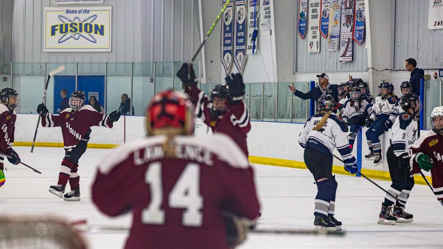 The University of South Carolina's women's hockey team celebrates after its 2-1 victory against the South Carolina Lady Warriors on Oct. 1, 2023, in Irmo, South Carolina. This matchup marks the first women's hockey game at the University of South Carolina in its 222 years of existence.