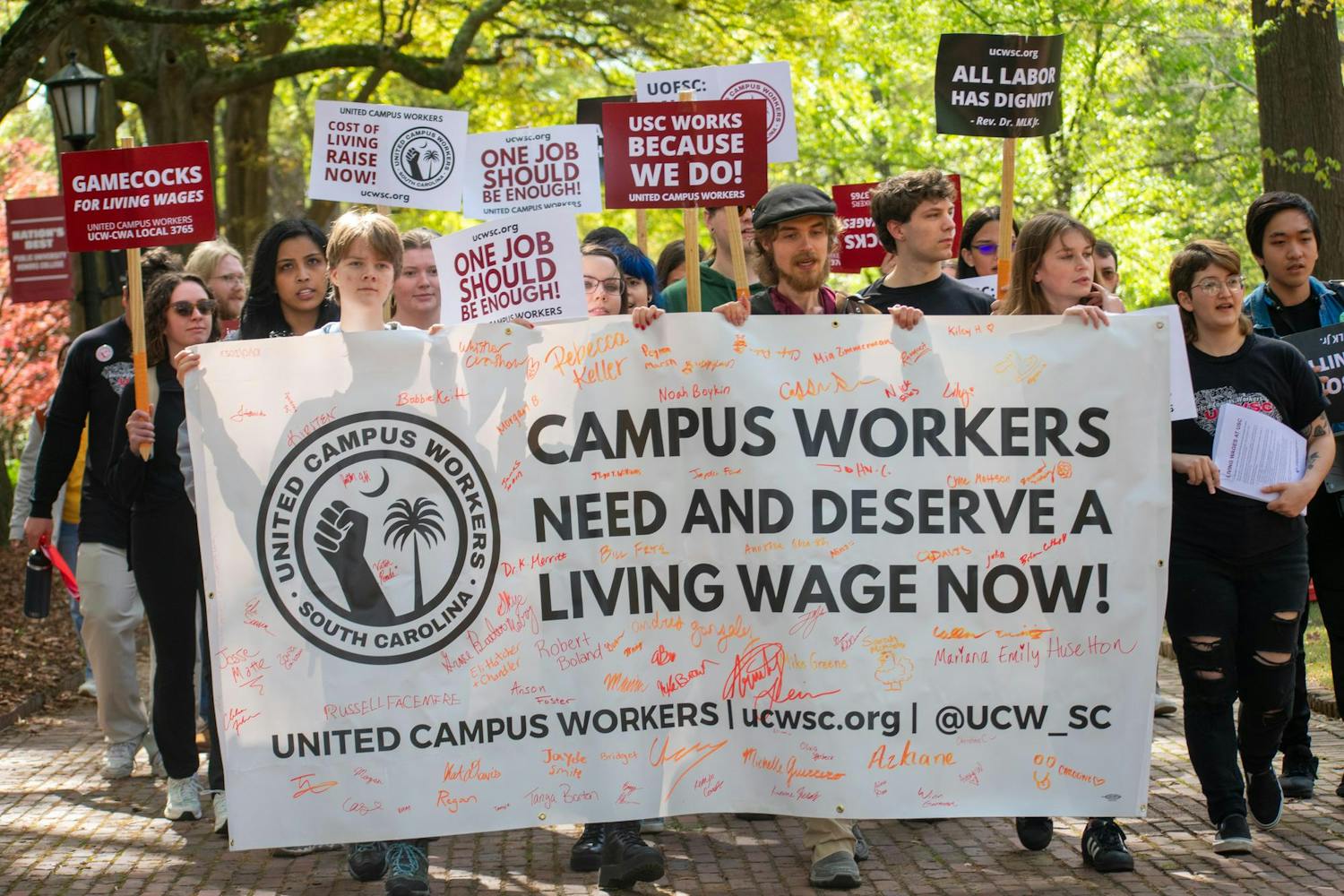 Members and supporters of the United Campus Workers march toward the Osborne Administrative Building following a rally outside of 鶹С򽴫ý President Michael Amiridis' home on March 28, 2024. The union delivered a petition created last August to Stacy Fritz, the chief of staff at the University of South Carolina.