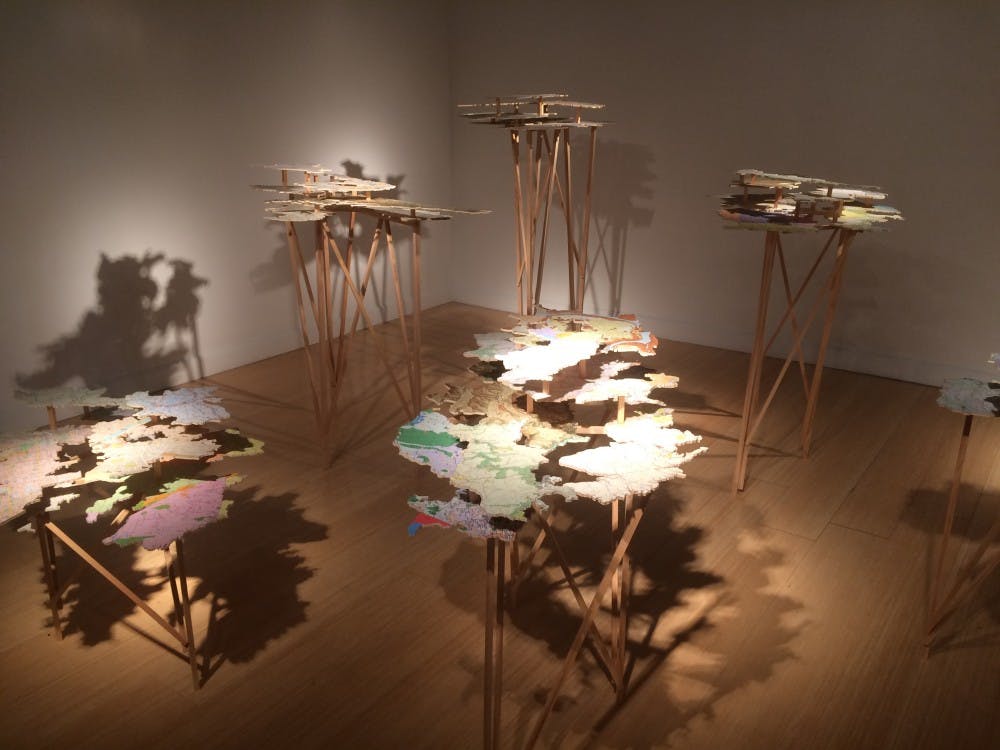 <p>The map and plywood structures of the <em>Fingerreisen</em> exhibit&nbsp;stand erect in the McMaster Gallery.</p>