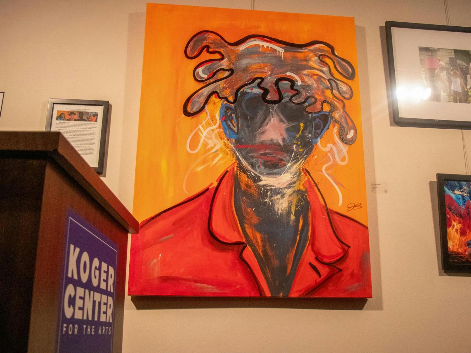 Artist Jahnna Blyden showcases her piece, "IMPLODE 100224," at the SC Pride Museum on Oct. 17, 2024. The exhibit, located at the Koger Center, highlights the intersection of art and LGBTQIA+ identity.
