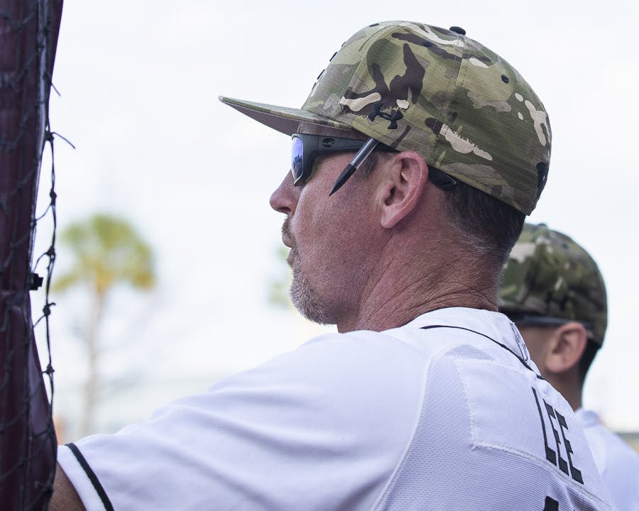 FILE—Associate head coach and recruiting coordinator Monte Lee watches from the dugout during a game against Winthrop on Feb. 21, 2023. The Gamecocks beat the Eagles 19-3.&nbsp;