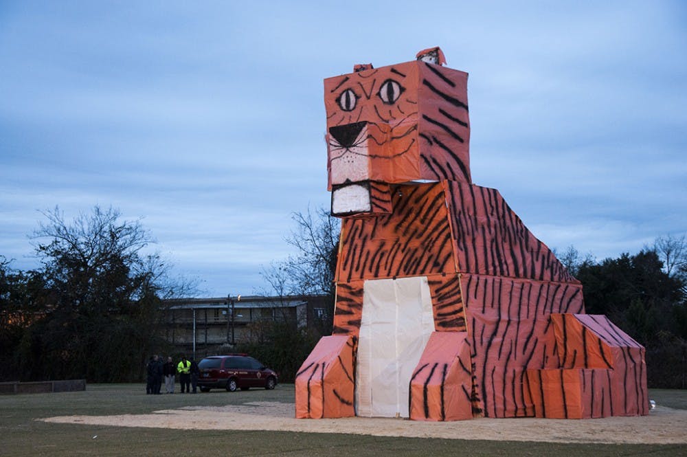 	The annual Tiger Burn took place at Greene St. intramural fields on a chilly Monday night. Hundreds of students gathered to watch the tradition of burning a wooden tiger to the ground, celebrating the longstanding rivalry between USC and Clemson. Cockapella, Swipe, Alpha Kappa Alpha, and Iota Beta Sigma gave live performances before the tiger was ignited.