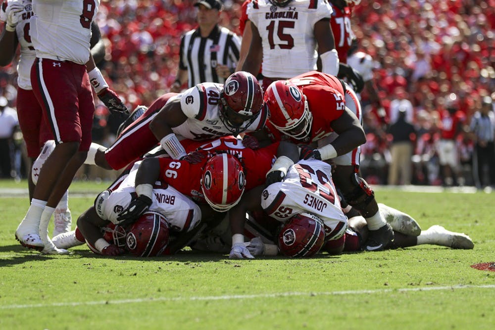 <p>The Gamecocks recover a fumble during the UGA game Saturday.</p>