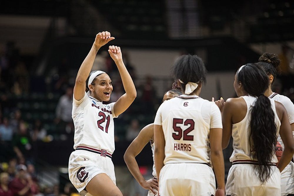 <p>Junior Mikiah Harrigan celebrates with her teammates after South Carolina secured a win against Florida State to advance to the Sweet 16 at the Halton Arena on Sunday.&nbsp;</p>