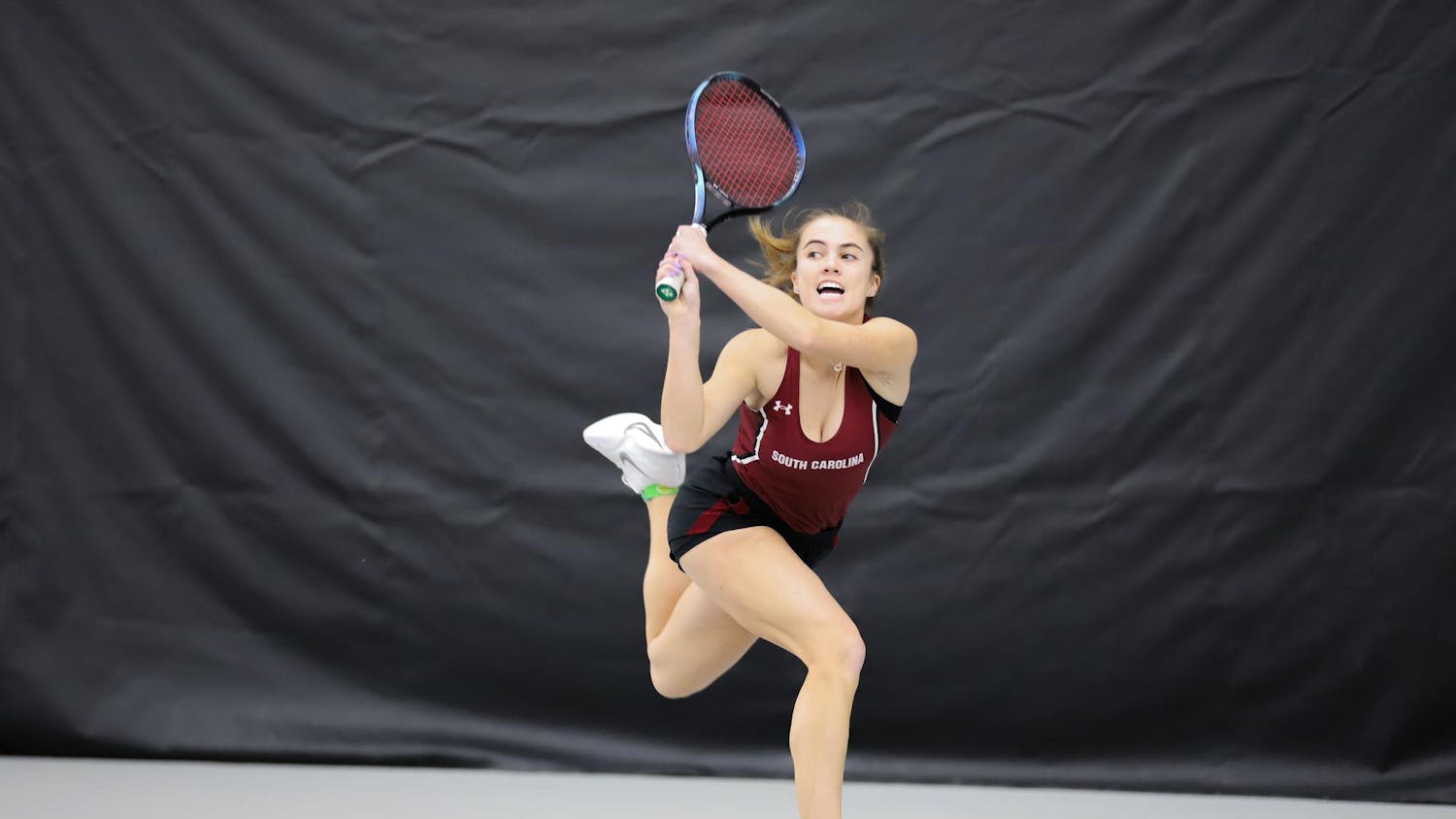 Junior Sarah Hamner runs to save the ball from falling out of bounds on Jan. 21, 2024, at the Carolina Indoor Tennis Center. Hamner won her singles match against Presbyterian 6-1, 6-2.