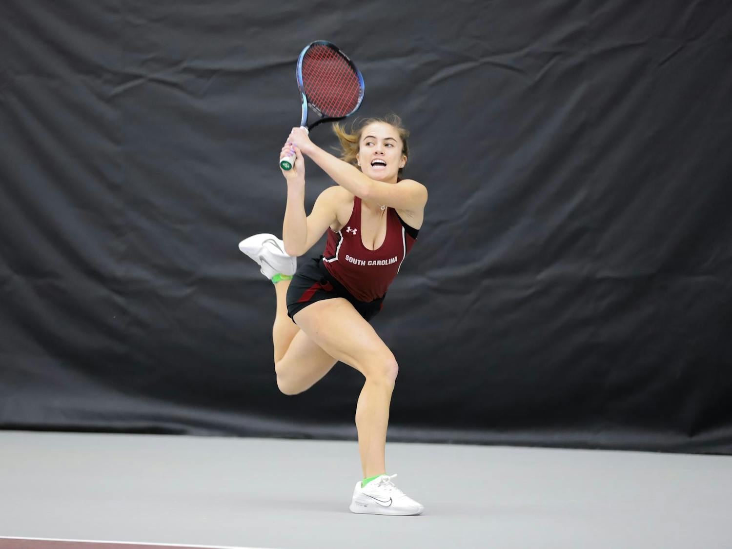 Junior Sarah Hamner runs to save the ball from falling out of bounds on Jan. 21, 2024, at the Carolina Indoor Tennis Center. Hamner won her singles match against Presbyterian 6-1, 6-2.