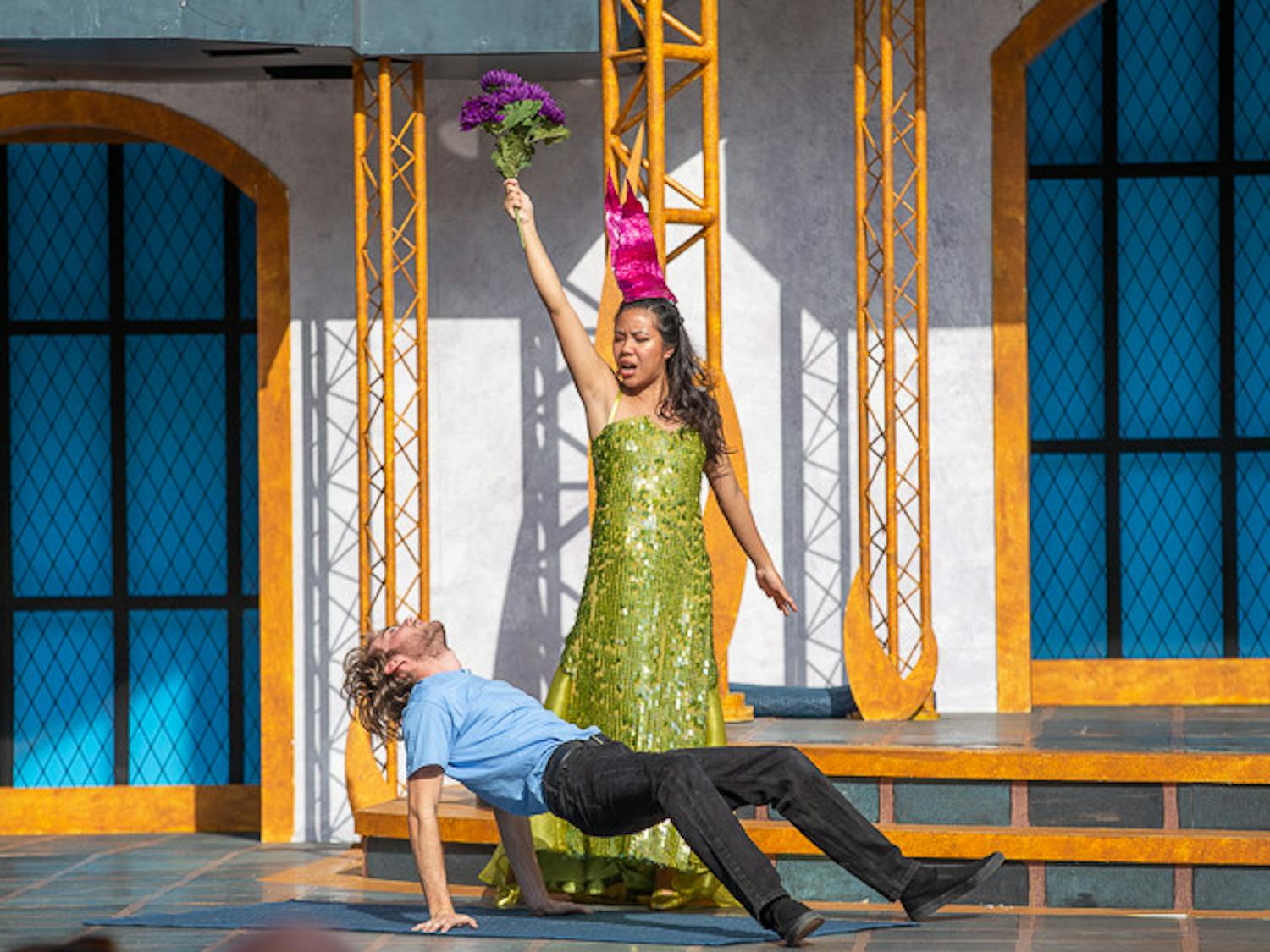 Titania, portrayed by fourth-year hospitality and tourism student Zoe Chan enchants Demetrius, portrayed by fourth-year film and media studies student Rayne Norris during the showing of "A Midsummer Night's Dream" on Oct. 9, 2022. &nbsp;USC Department of Theatre and Dance held the play from October 2 to 9, 2022.&nbsp;