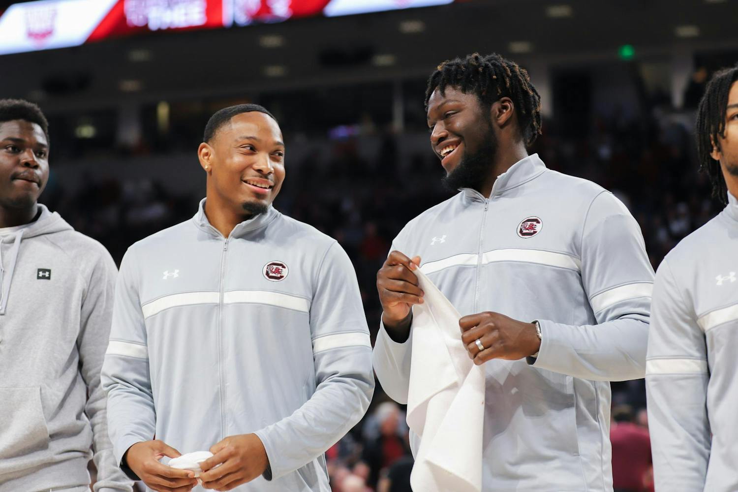 FILE- Gamecock football recruits redshirt sophomore defensive back Gerald Kilgore (left) and graduate student linebacker Demetrius Knight Jr. (right) laugh while being acknowledged during halftime at a Gamecock men's basketball game on Jan. 27, 2024. Gerald Kilgore will join his younger brother, sophomore defensive back Jalon Kilgore, on the team.