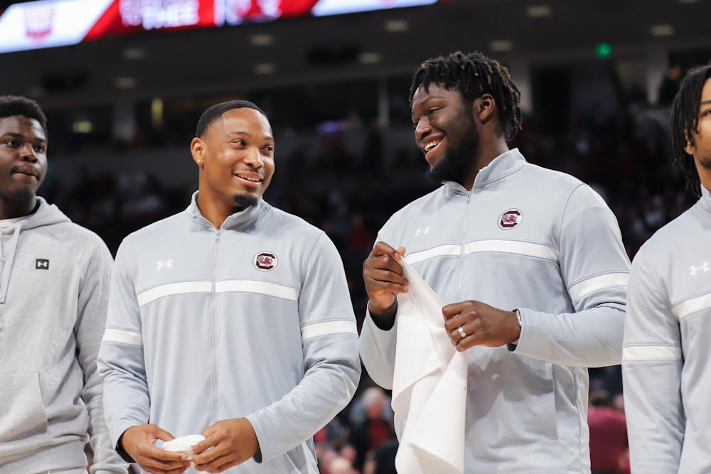 <p>FILE- ɫɫƵ football recruits redshirt sophomore defensive back Gerald Kilgore (left) and graduate ɫɫƵ linebacker Demetrius Knight Jr. (right) laugh while being acknowledged during halftime at a ɫɫƵ men's basketball game on Jan. 27, 2024. Gerald Kilgore will join his younger brother, sophomore defensive back Jalon Kilgore, on the team.</p>