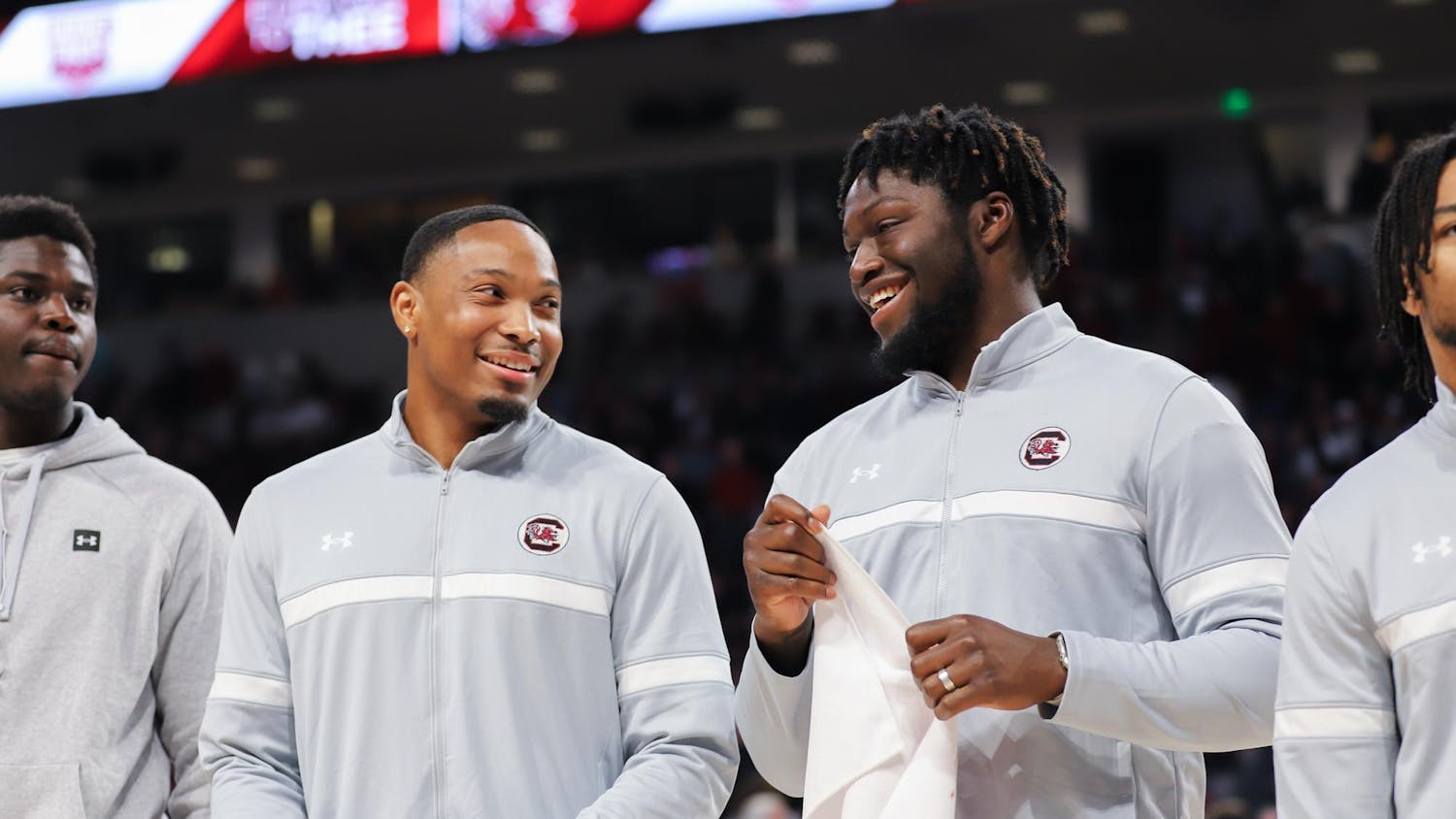 FILE- Gamecock football recruits redshirt sophomore defensive back Gerald Kilgore (left) and graduate student linebacker Demetrius Knight Jr. (right) laugh while being acknowledged during halftime at a Gamecock men's basketball game on Jan. 27, 2024. Gerald Kilgore will join his younger brother, sophomore defensive back Jalon Kilgore, on the team.