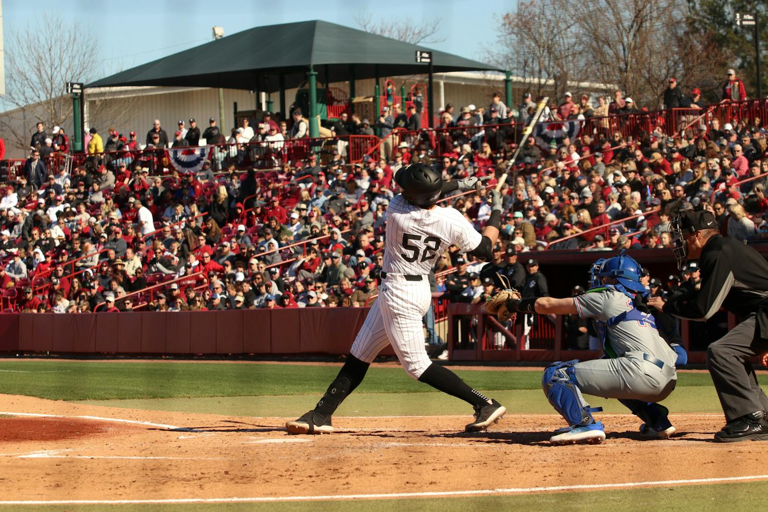FILE — Junior first baseman Gavin Casas takes a strike against UMass Lowell at Founders Park on Feb. 18, 2023. Casas put up 1 of the Gamecocks' 17 points this game against the River Hawks' 1 point.&nbsp;
