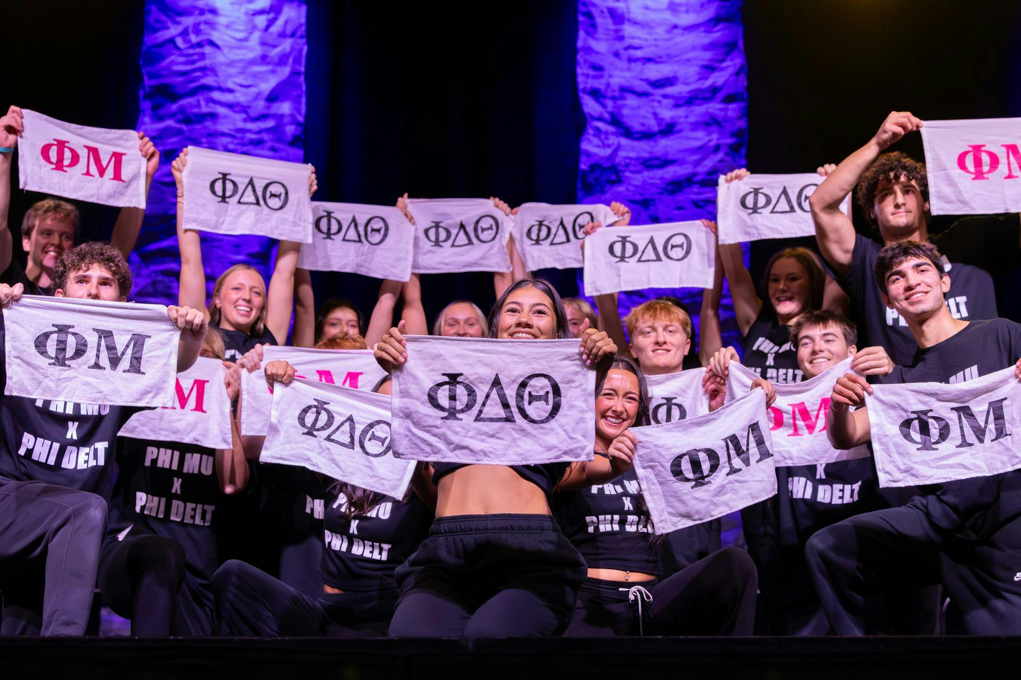 Members of Phi Mu and Phi Delta Theta pose with rally towels after finishing their Spurs &amp; Struts routine on Oct. 22, 2025, at the Columbia Metropolitan Convention Center. Kappa Delta and Sigma Alpha Epsilon took home the first place prize out of 20 groups who competed this year.