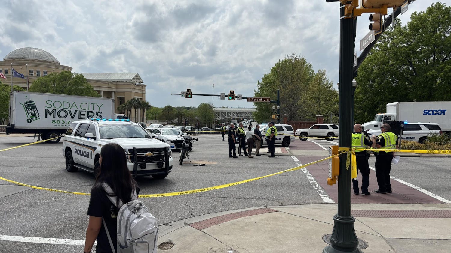 Columbia police surround the scene of the accident at the intersection of Assembly and Blossom streets on April 2, 2025. The student’s motorcycle remains standing on the street.