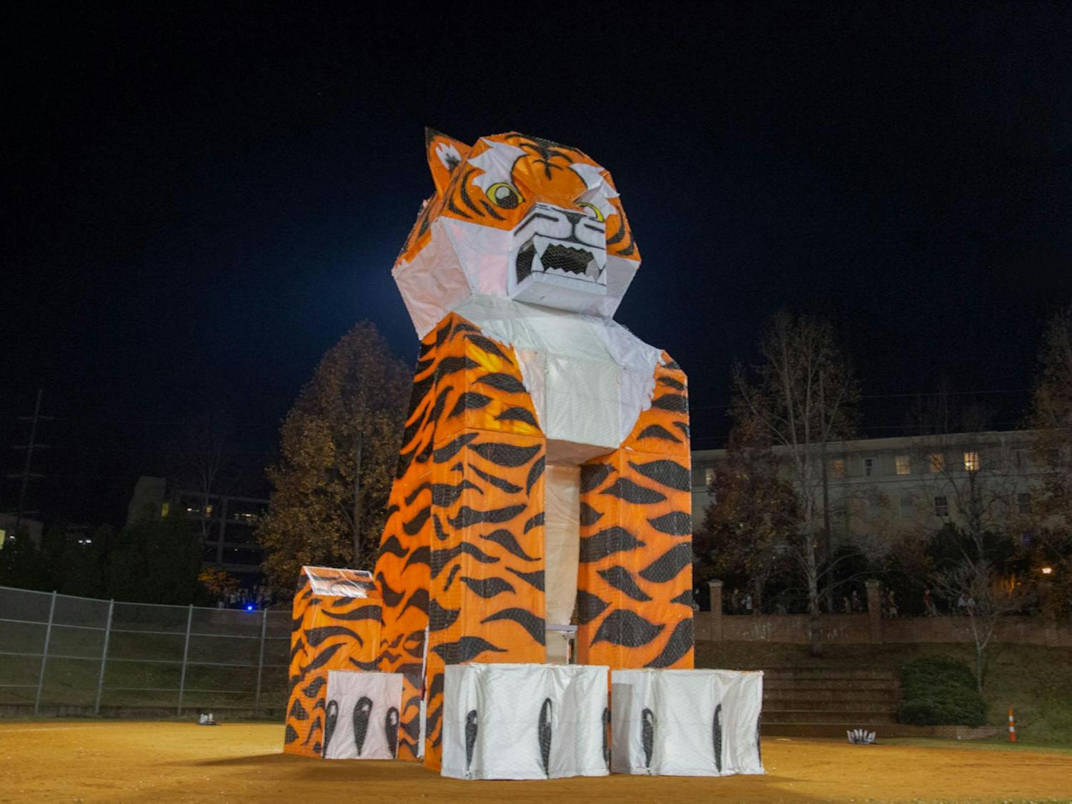South Carolina’s “tiger” sits as students enter the Blatt Field for the annual Tiger Burn event on Nov. 19, 2025. The structure is designed and built by the USC chapter of the American Society of Mechanical Engineers every year.