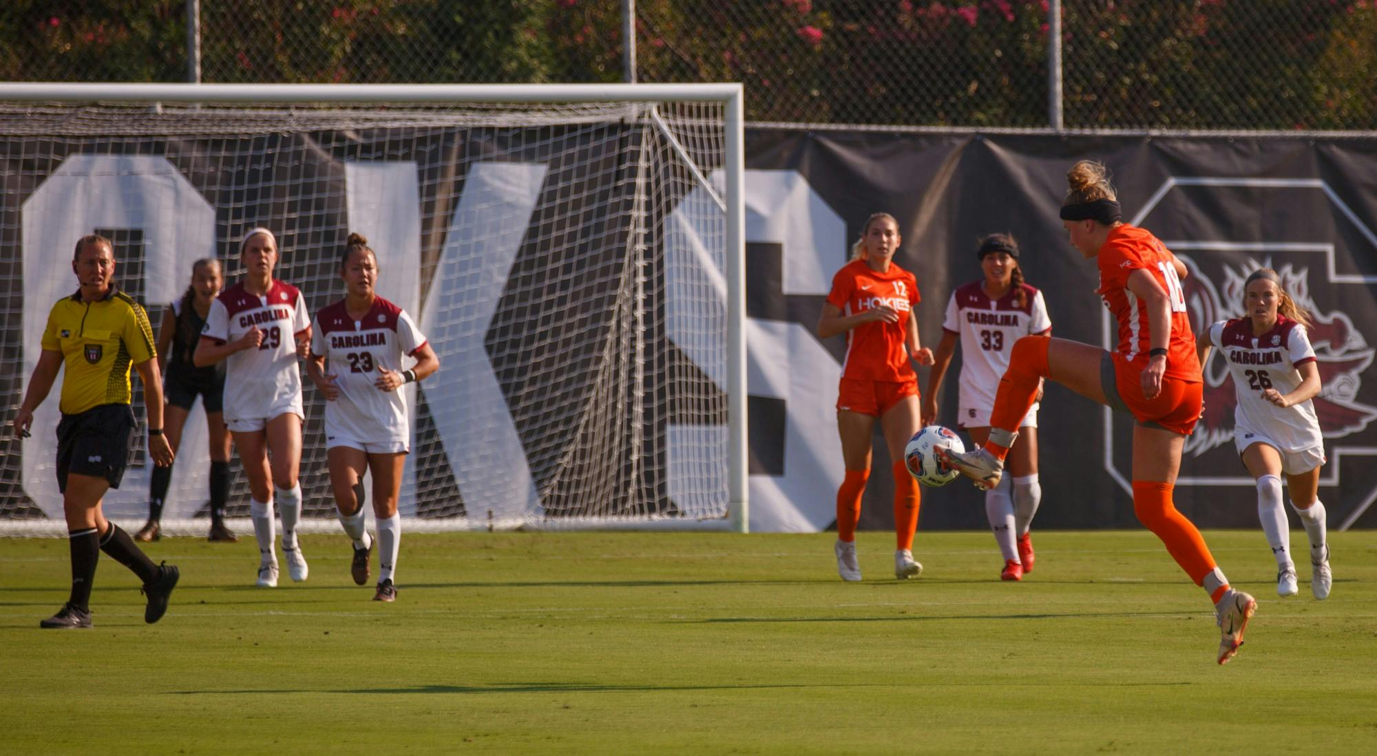 Freshman midfielder Lauren Gogal kicks the ball toward her teammates for Virginia Tech.