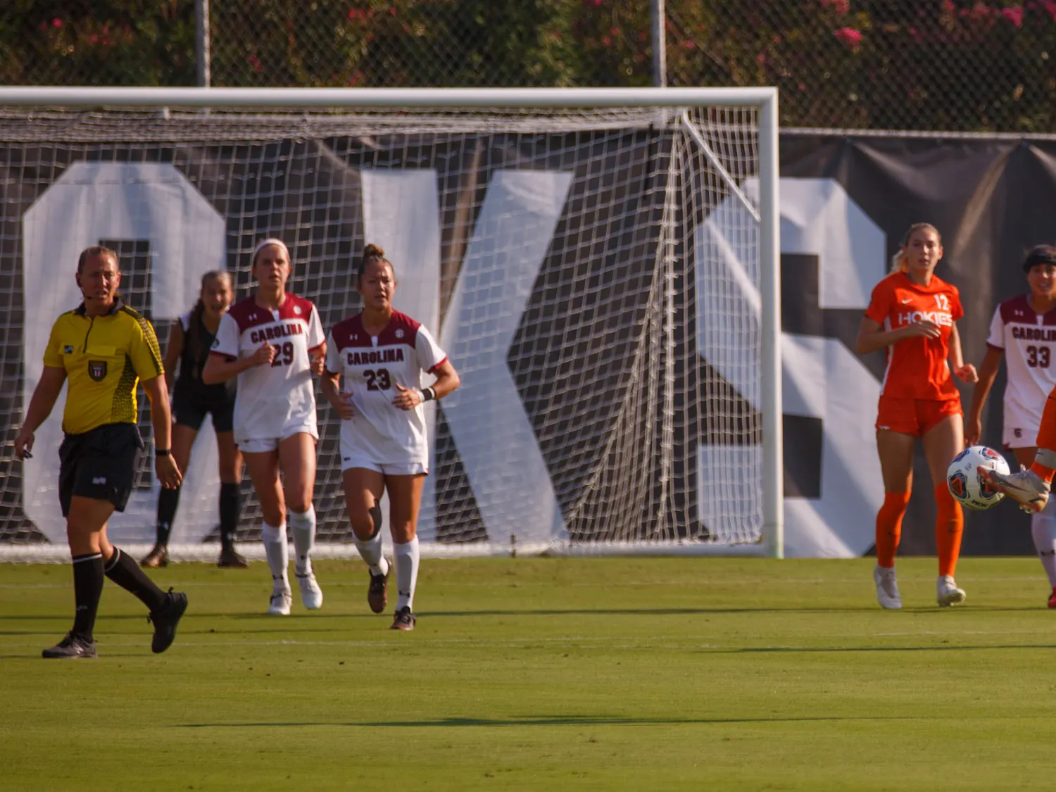 Freshman midfielder Lauren Gogal kicks the ball toward her teammates for Virginia Tech.